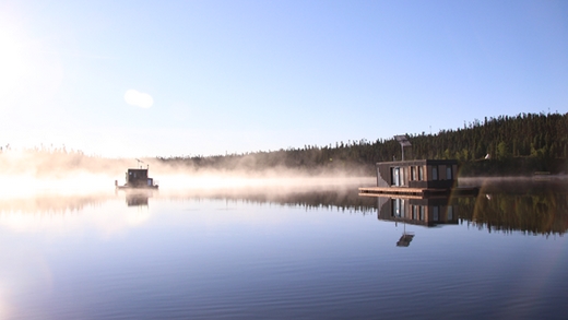 Houseboats floting on a misty lake