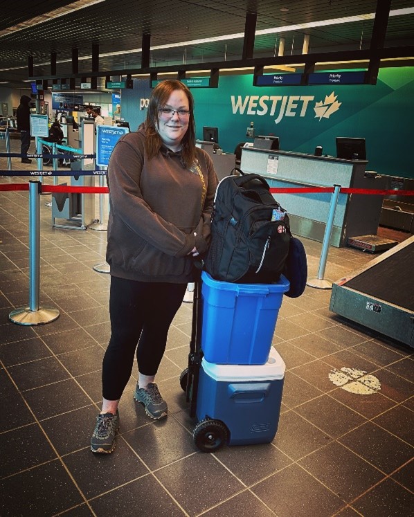 Melissa Turk-Fayle boarding a plane on her nursing journey.