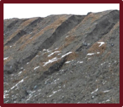 Slope with failures. Sides are too steep and are not well packed.
