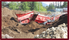 A screened topsoil, sand and gravel, and rocky soil